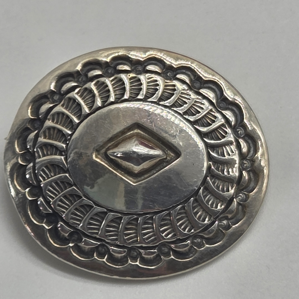 native american engraved concho brooch sterling silver marked PTG sterling oval